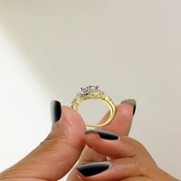 U 10k uvijenom žutom zlatu, laboratorij okruglog reza u MIB-u stvorio je zaručnički prsten od moissanita i prirodnog dijamanta u